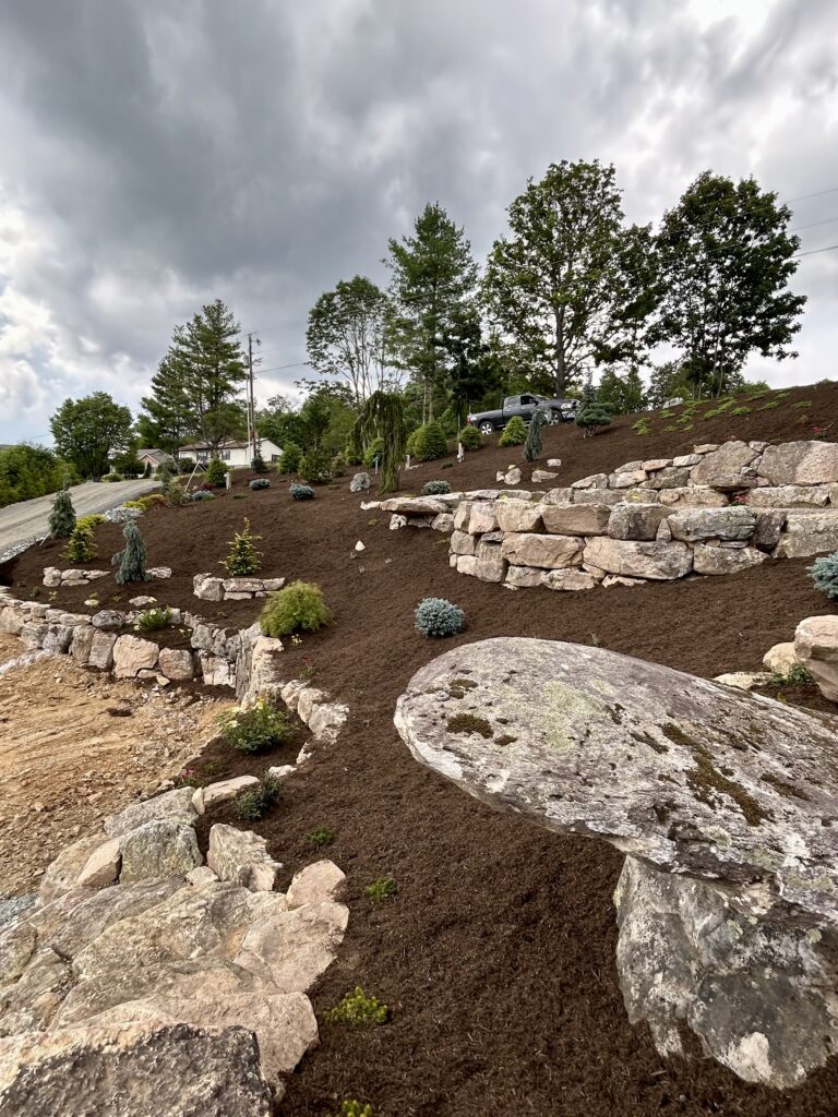A natural stone custom boulder wall project in Blowing Rock NC